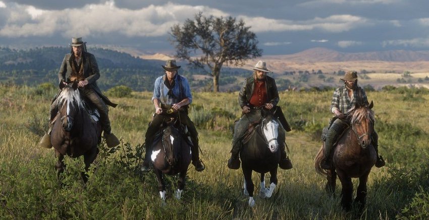 Скриншот игры Red Dead Redemption 2 - всадники на лошадях